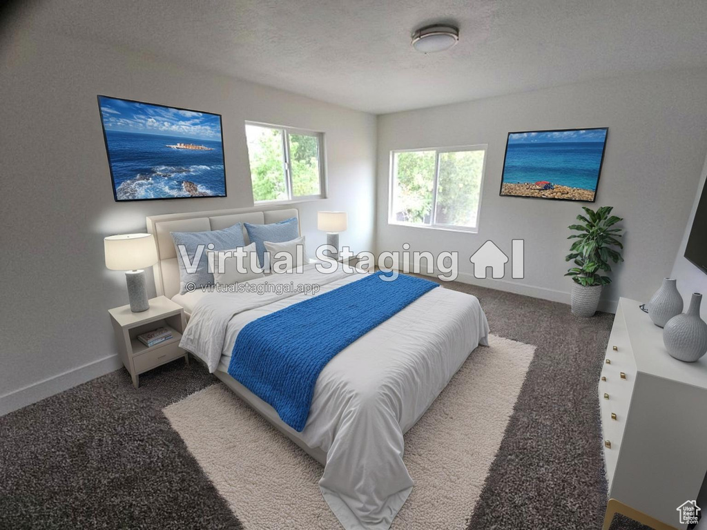 Bedroom featuring carpet floors and a textured ceiling