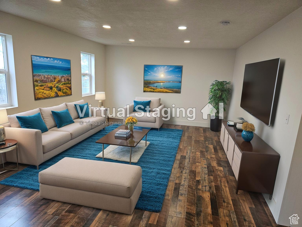 Living room with recessed lighting, hardwood / wood-style floors, and a textured ceiling