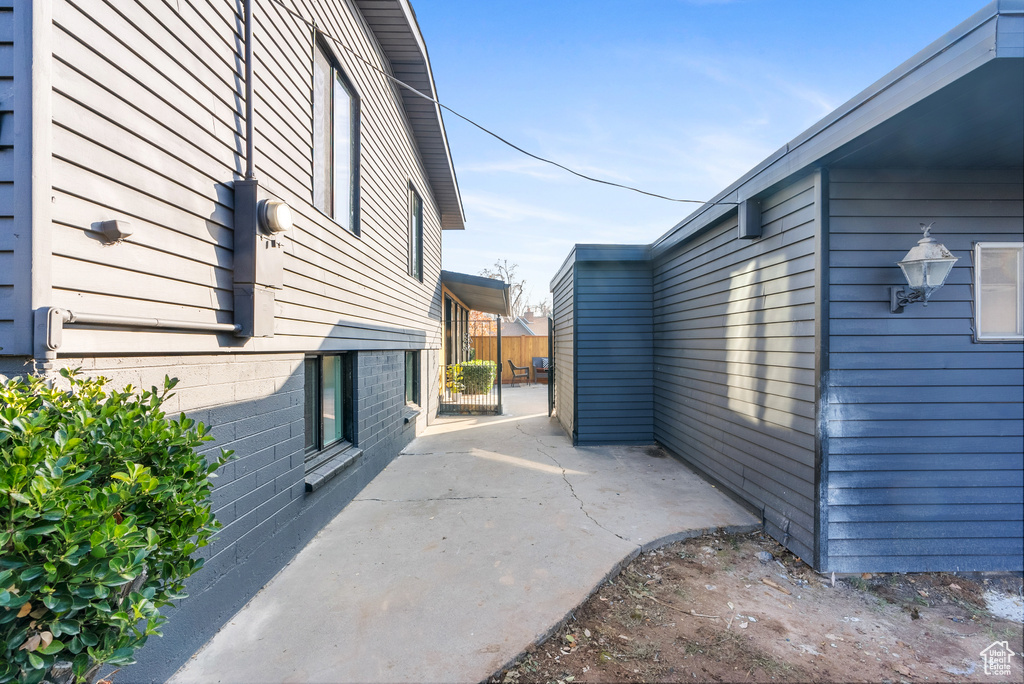 View of side of property featuring a patio