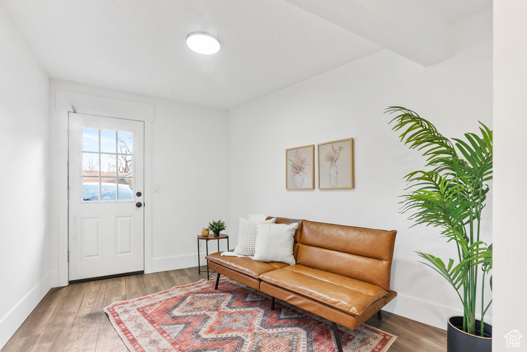 Living area featuring wood finished floors and baseboards