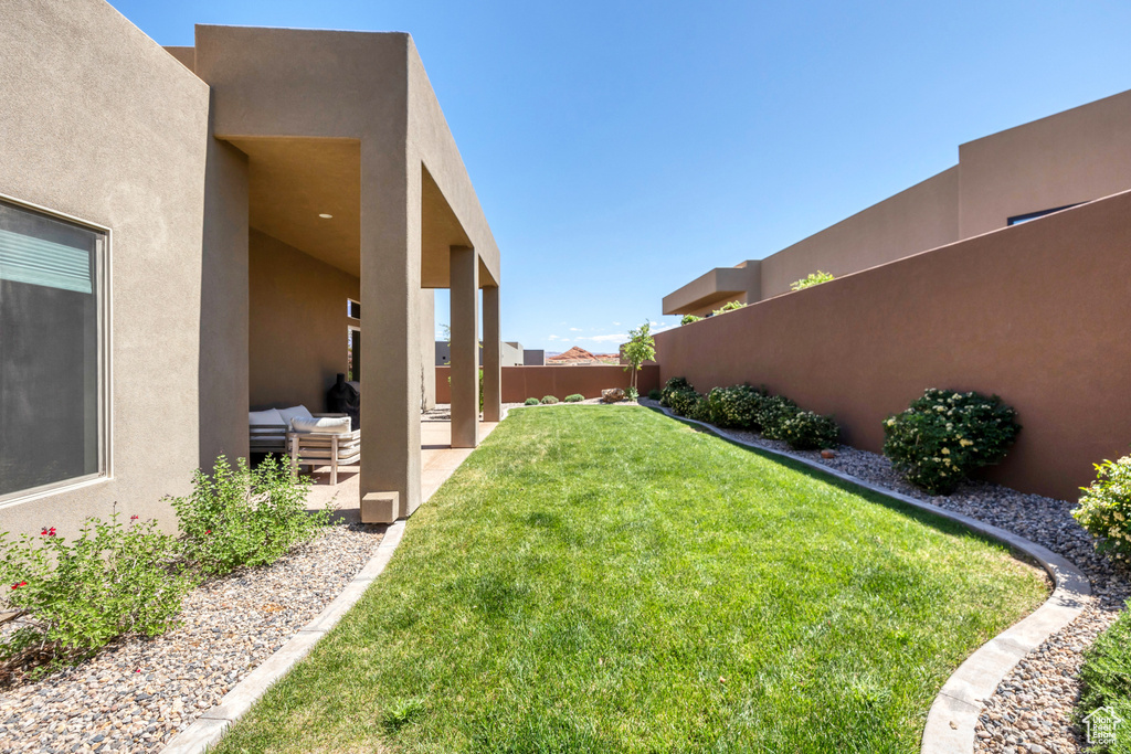 View of yard featuring a patio and a fenced backyard