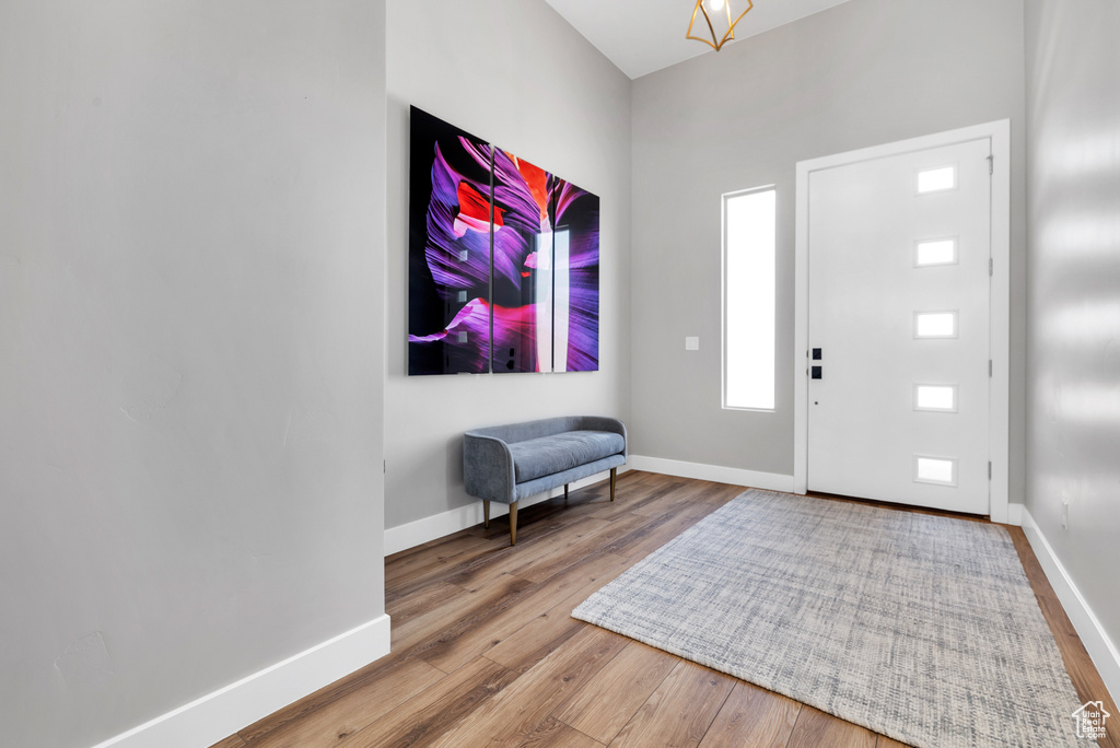 Foyer featuring wood finished floors and baseboards