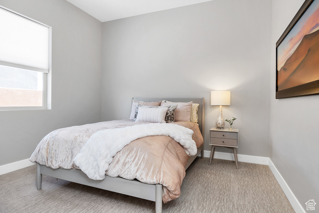 Carpeted bedroom with baseboards