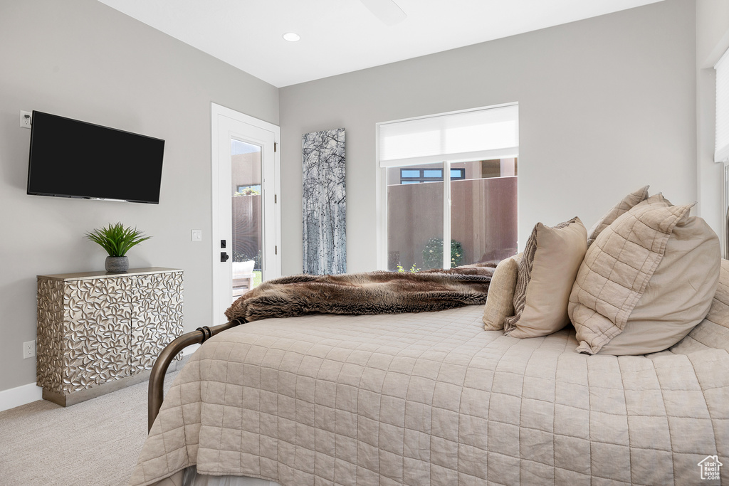 Carpeted bedroom featuring recessed lighting, ceiling fan, and baseboards