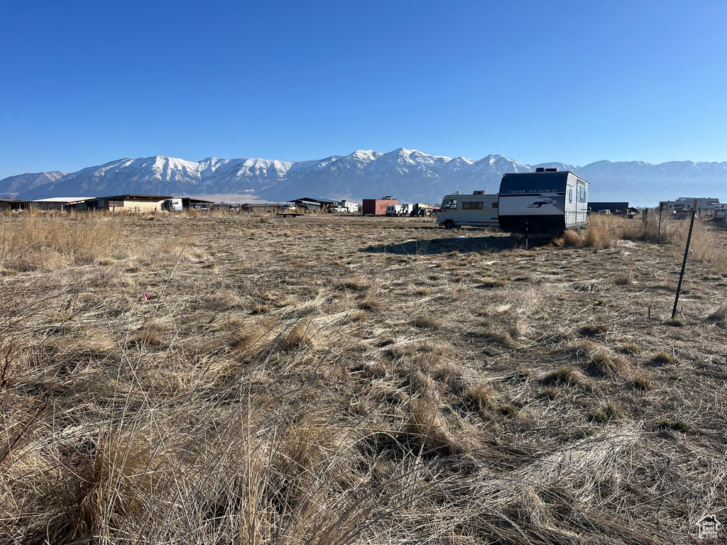 Property view of mountains with a rural view