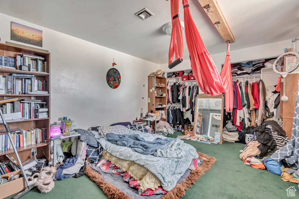 Bedroom featuring carpet and visible vents