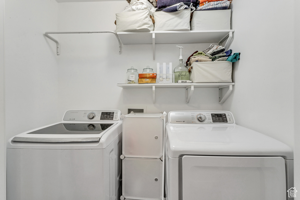 Laundry room featuring washer and dryer and laundry area