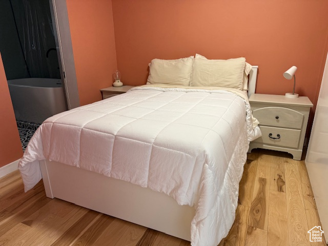 Bedroom with wood finished floors