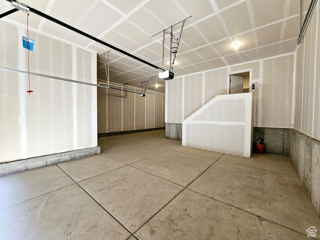 Garage featuring a garage door opener