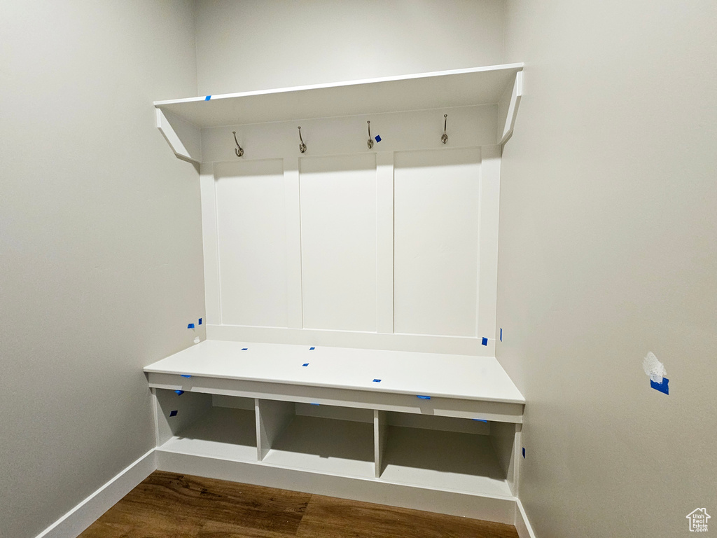 Mudroom with baseboards and wood finished floors