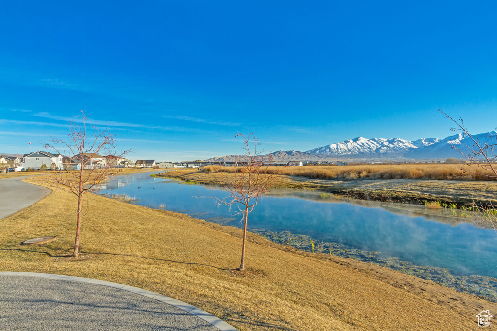 View of water feature featuring a mountain view and a residential view