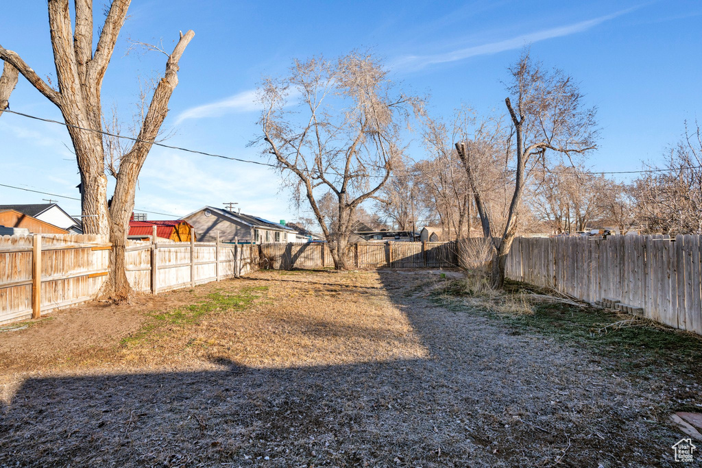 View of yard with a fenced backyard