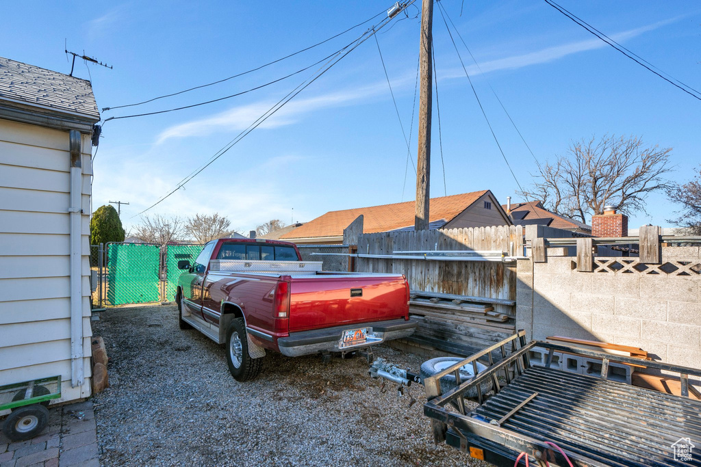 View of yard featuring fence