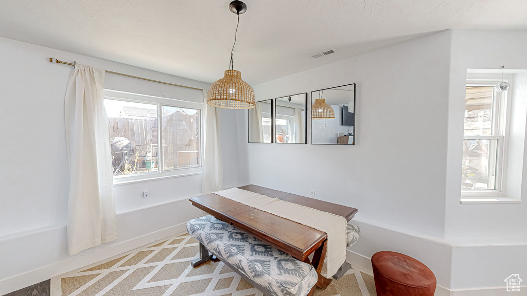 Dining space with visible vents and baseboards