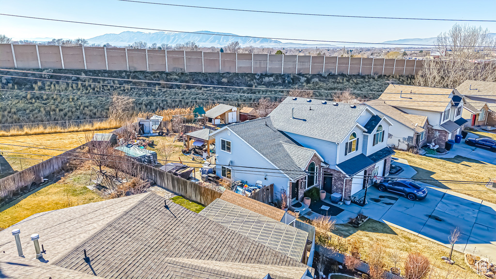 Birds eye view of property with a residential view and a mountain view