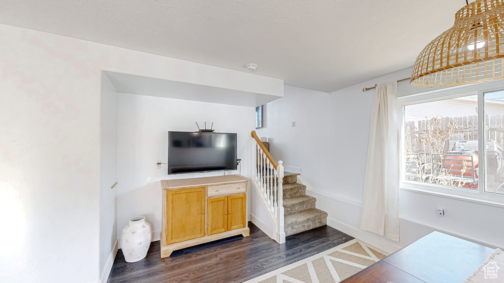 Stairs with baseboards and wood finished floors