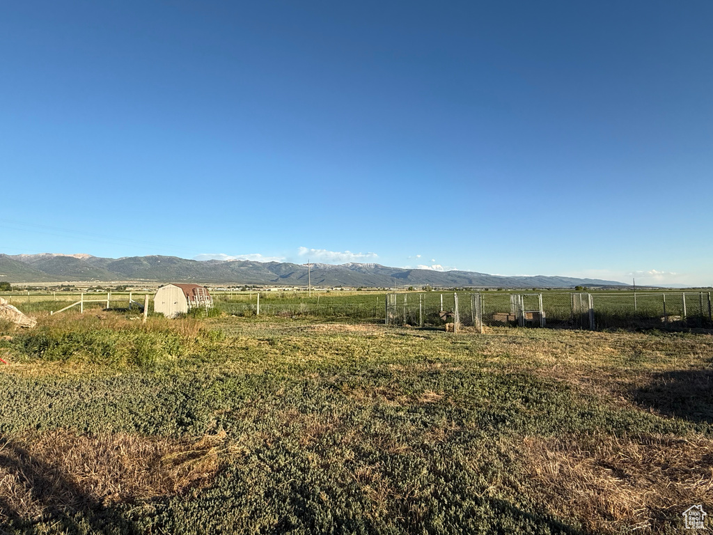 View of mountain background featuring rural landscape