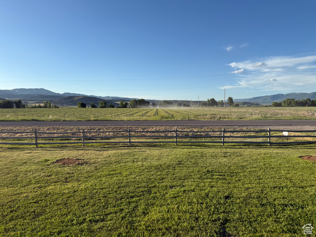 View of yard with a view of rural / pastoral area and a mountain view