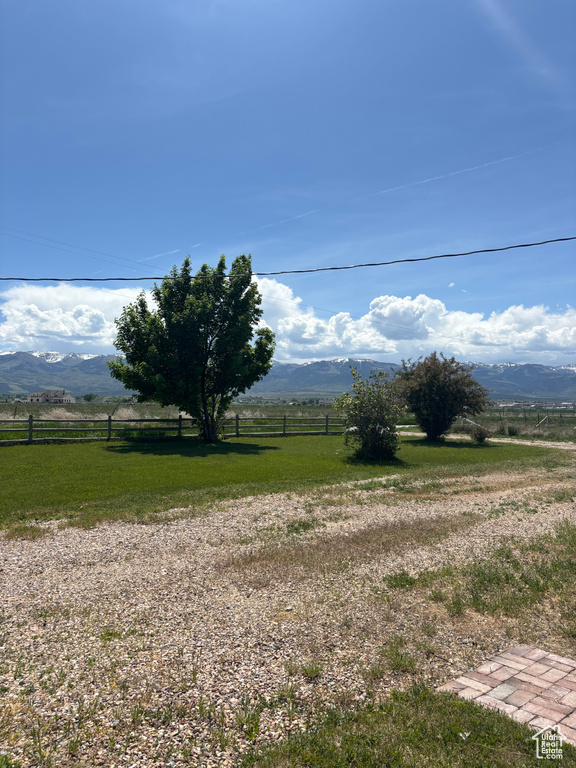 View of yard with a view of countryside and a mountain view