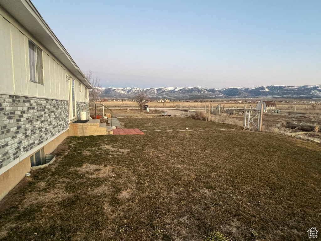 View of yard with a patio area and a mountain view