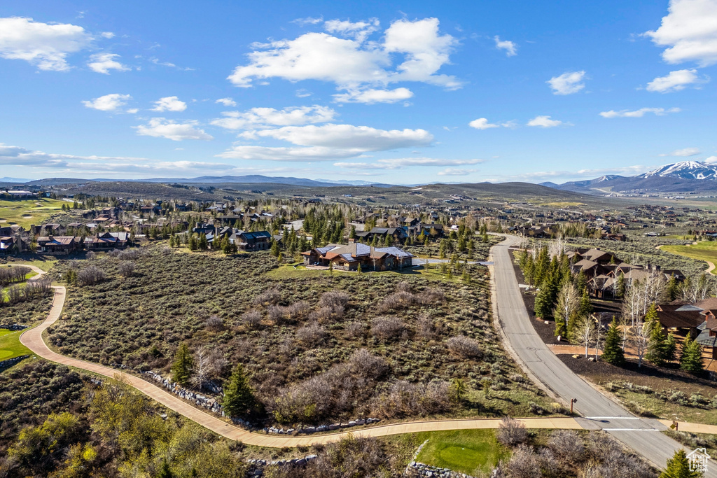 Drone / aerial view with a residential view and a mountain view