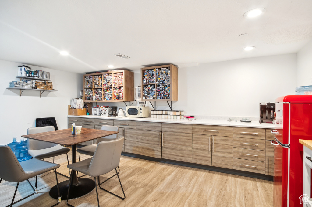 Dining room with recessed lighting, visible vents, and light wood-style flooring