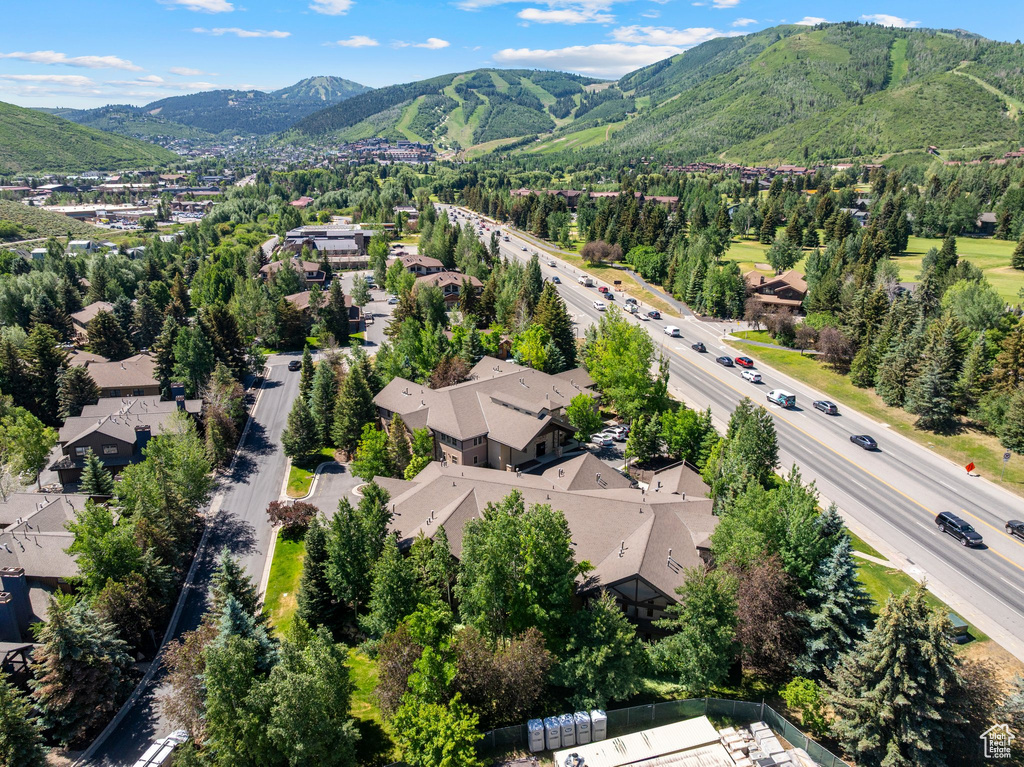 Aerial perspective of suburban area with a mountainous background