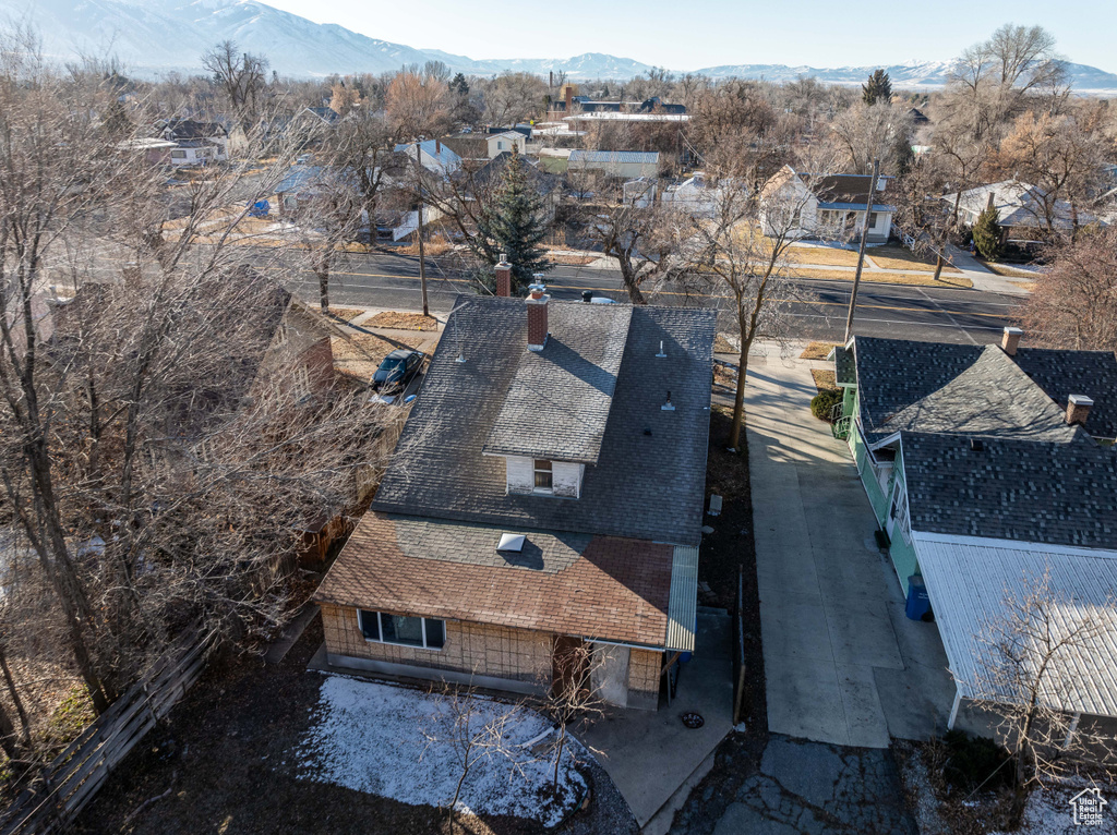 Birds eye view of property with a residential view and a mountain view