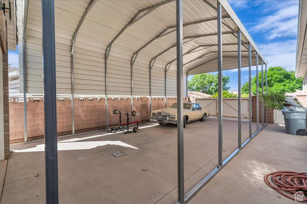 View of car parking featuring a carport