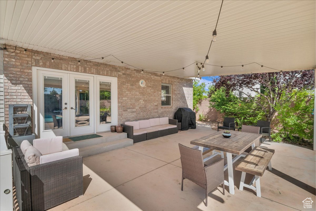 View of patio / terrace with french doors, outdoor lounge area, and grilling area