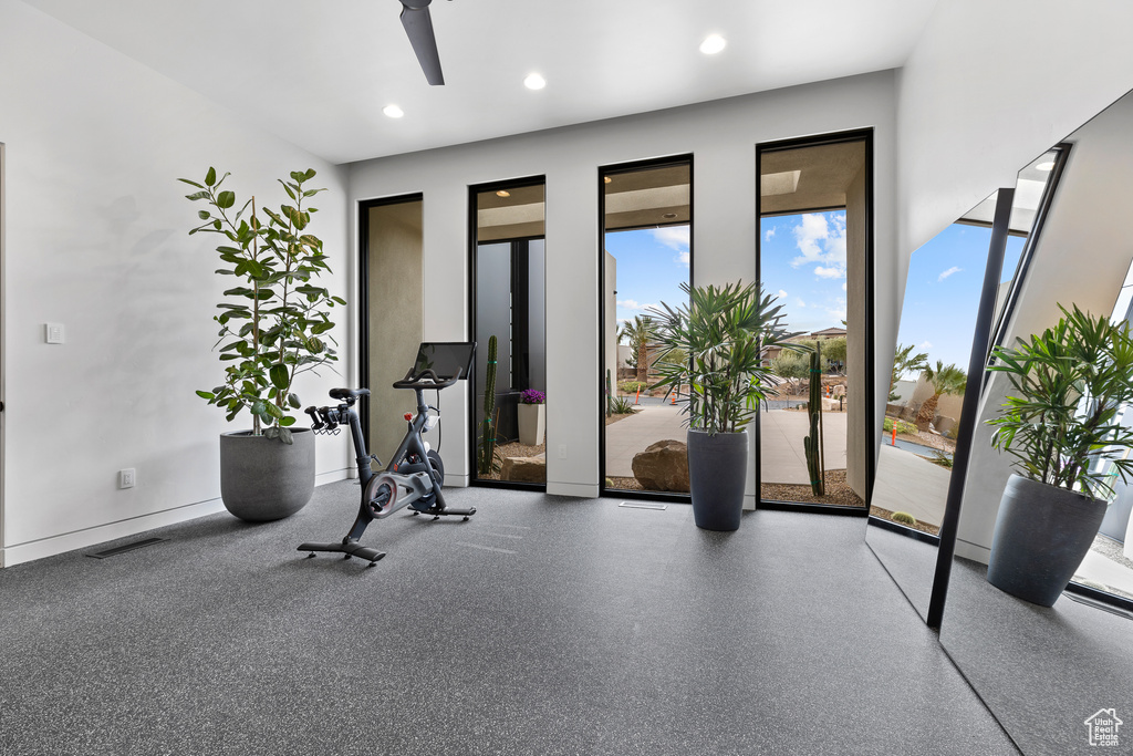 Exercise area featuring a ceiling fan, recessed lighting, and visible vents