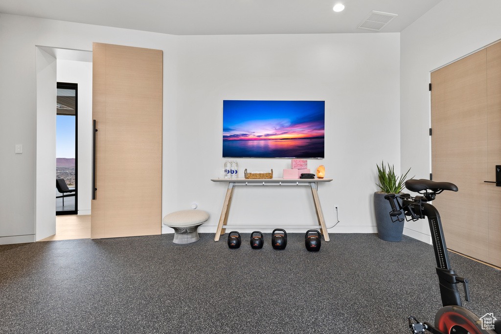 Unfurnished living room with recessed lighting and visible vents