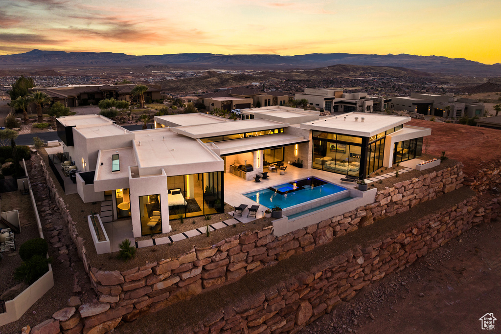 Exterior space featuring a patio, a mountain view, and an outdoor pool