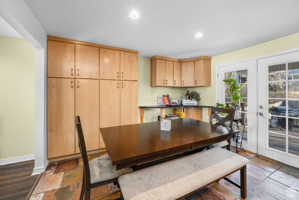 Dining room with recessed lighting, stone tile flooring, french doors, and baseboards