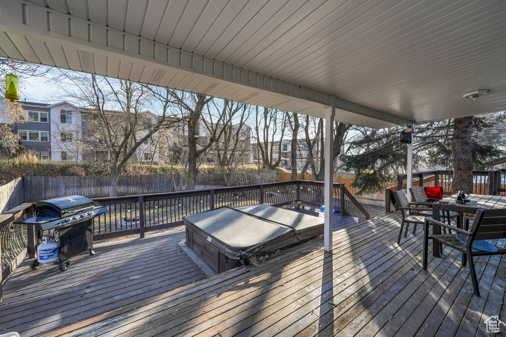 Wooden deck featuring grilling area