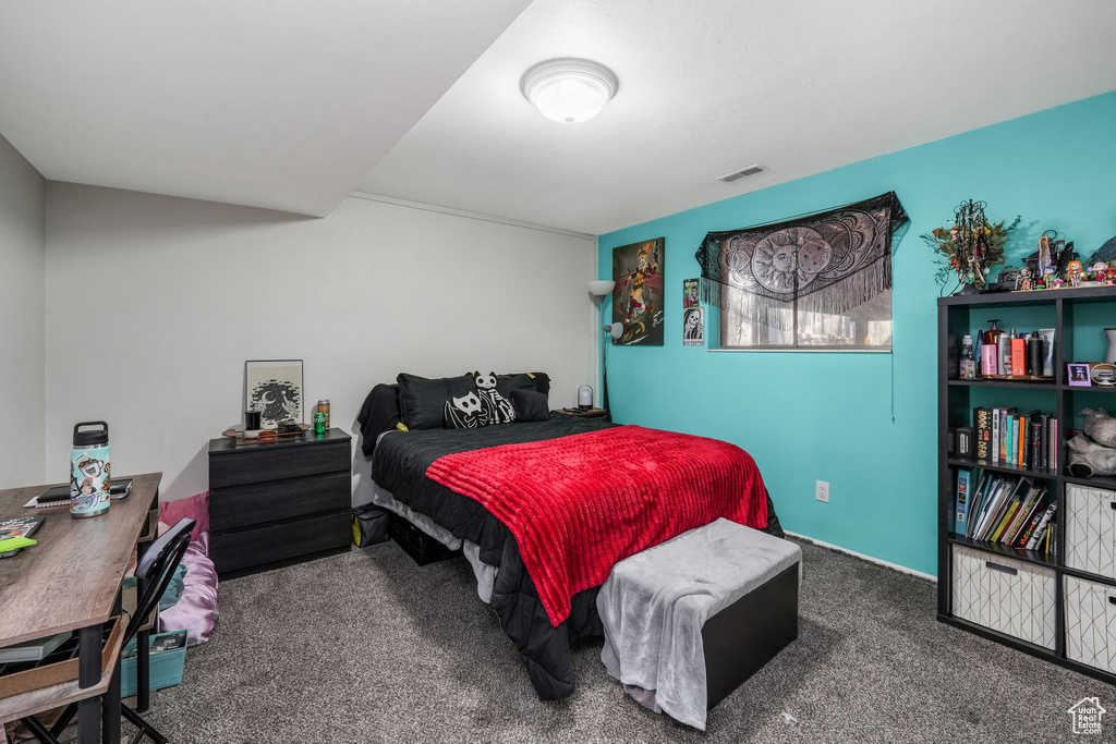 Bedroom featuring visible vents and carpet flooring