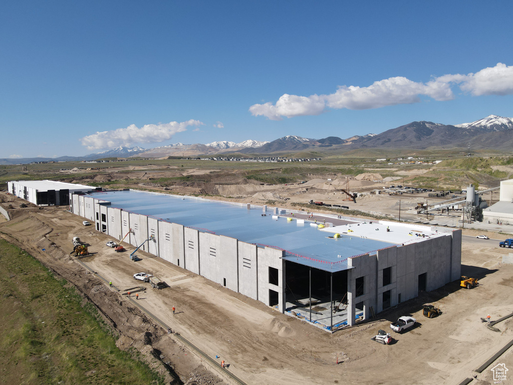 Birds eye view of property with a mountain view