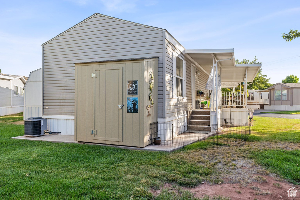 View of outdoor structure featuring an outdoor structure and central air condition unit