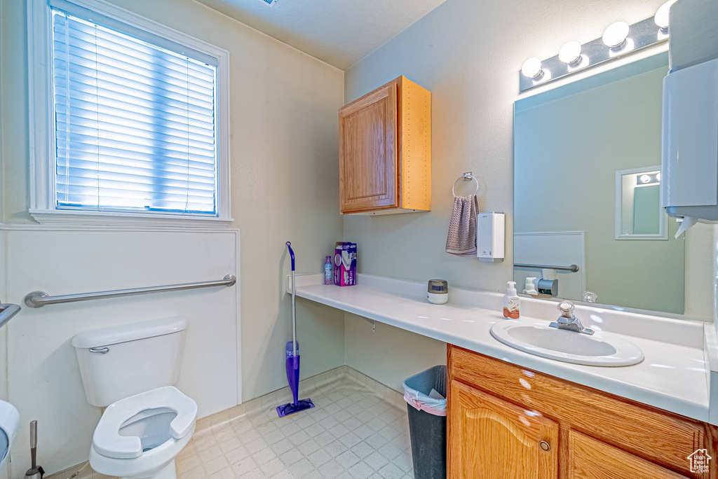 Bathroom with vanity and toilet