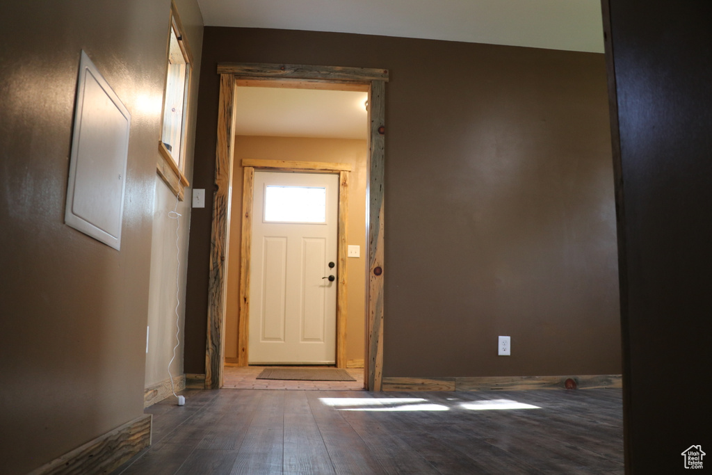 Entryway featuring wood finished floors and baseboards