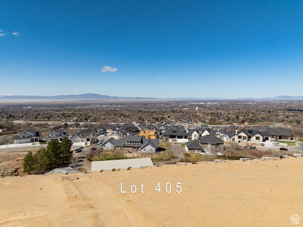 Birds eye view of property with a mountain view and a residential view