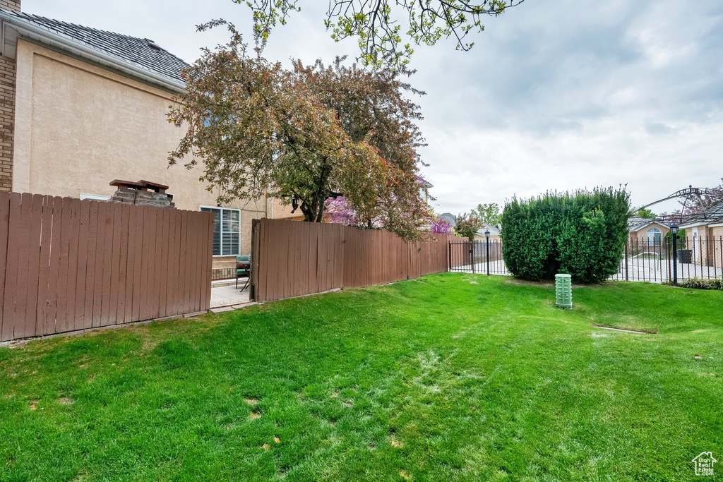 View of yard featuring fence