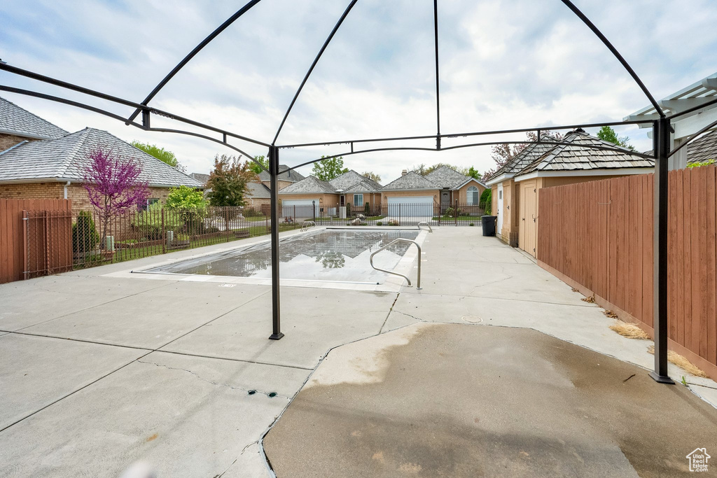 View of swimming pool with fence