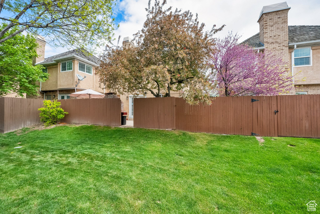 View of yard featuring a fenced backyard