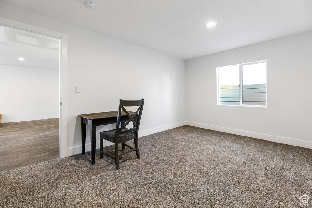 Office featuring baseboards, dark carpet, and recessed lighting