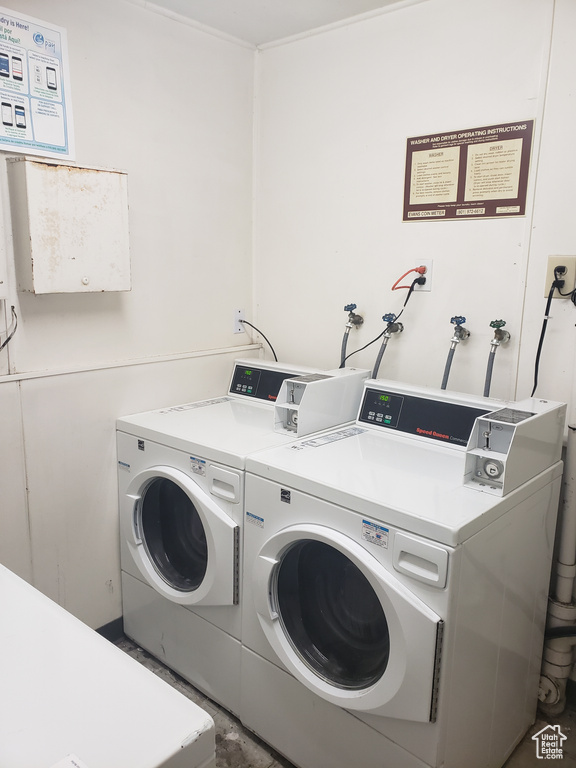 Community laundry room with separate washer and dryer