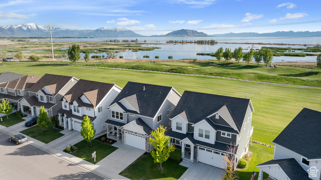 Aerial view featuring a water and mountain view