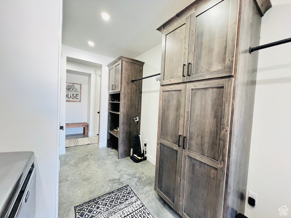 Interior space featuring concrete flooring and recessed lighting