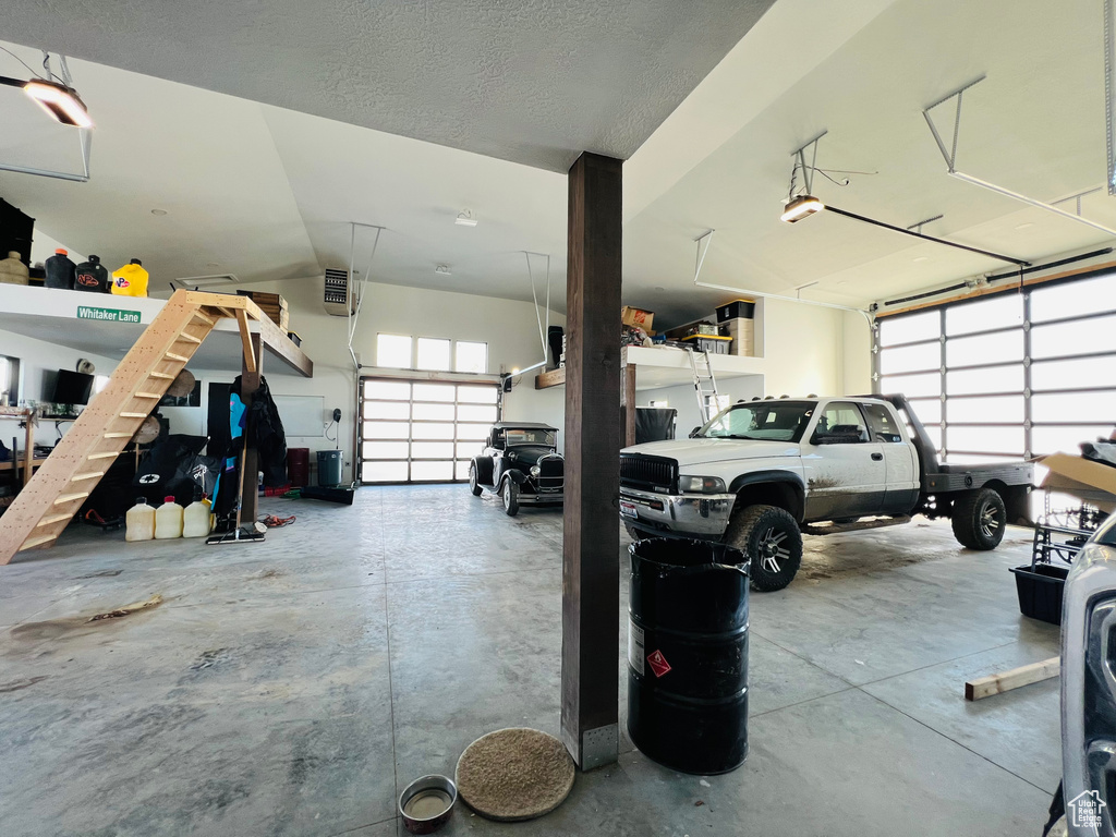 Garage featuring a garage door opener