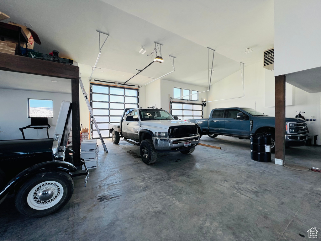 Garage featuring a garage door opener